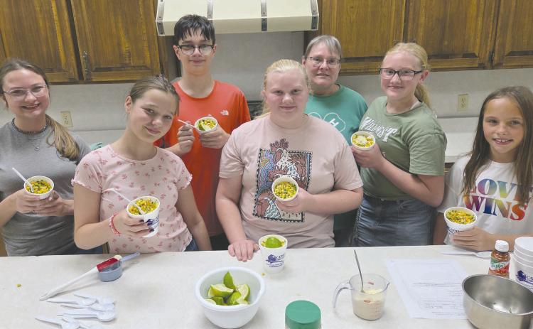 Students participating in Ochiltree County 4-H’s Foods Project got together last Thursday to make elote, or Mexican street corn. Eight of the students taking part in the project will be traveling to District competition in Canyon on Oct. 27. Pictured are, from left, front row: Kaylynn Tarango, Rebekah Young, and Izzy Heck; back row: Kylee Knox, Lou Tarango, project leader Shelley Haller, and Hannah Young