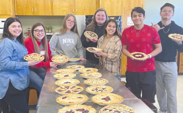 YOUNG BAKERS—Students from Perryton High School’s Culinary Arts program show off some of the many pies they baked and entered into the annual Rotary Pie Contest, which was held on Saturday, Feb. 19. Pictured are, from left, Jackie Juarez, Emmali Mariscal, Jessica Painter, Rylee Williams, Alyssa Rosales, Jonathan Espino, and Adriel Molinar.