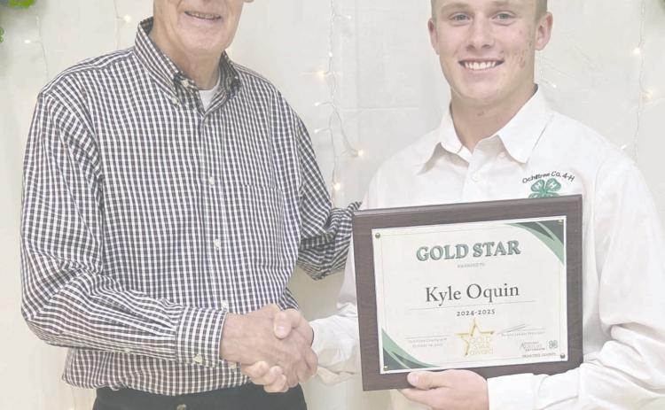 Ochiltree County 4-H held their annual awards ceremony Tuesday evening at the Ochiltree County Expo Center. The winner of the Gold Star Award, the highest county award that can be given to a 4-H member was Kyle Oquin, who received a plaque from the county, a pin, and a certificate from the state. Pictured are, from left, County Judge Charles Kelly, who presented the award, and Oquin.