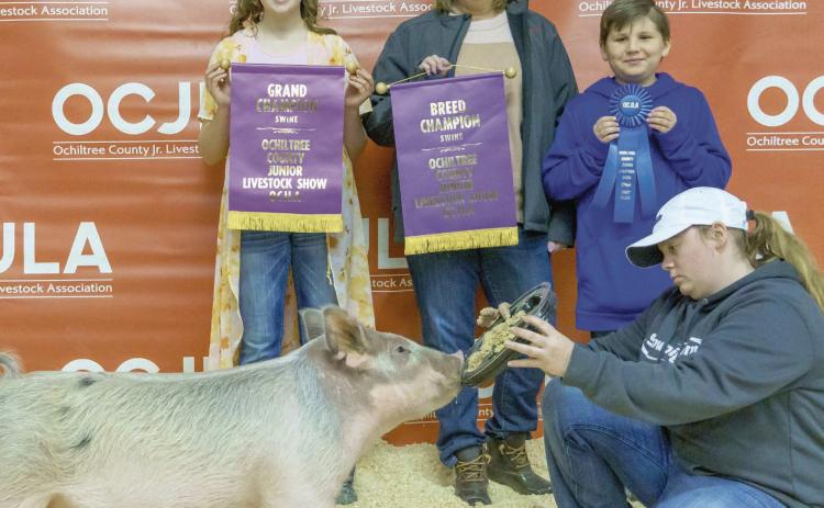 GRAND CHAMPION SWINE— At the Ochiltree County Junior Livestock Show and Sale on Jan. 20-21, Caydee Butler took home the award for Grand Champion Swine. Her animal was purchased by Duvall Farms. Pictured are, from left, Caydee Butler, Cindy Duvall, Graham Duvall, and Casidee Butler. ( Photo Credit: Brittany Morgan)