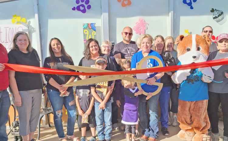 RIBBON CUTTING FOR MUTT HUTT BAKERY— Perryton-Ochiltree Chamber of Commerce members gathered last Friday afternoon for a ribbon-cutting ceremony to commemorate the grand opening of the Mutt Hutt Bakery and Boutique at 212 SW 3rd Street in Perryton. The pet bakery and boutique is owned by Ryan and Audra Wells.