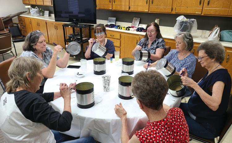 CREATING HOMEMADE DECOR The Ochiltree County Senior Citizens Center held a crafting day on Monday afternoon. Members at the center made tabletop centerpiece decorations and wasp/insect traps. Pictured are, clockwise from bottom right: Nancy Cain, Frances Aston, Penny Clark, Toni Boren, Becky Childers, Charlotte Cape, and Kay Allison.
