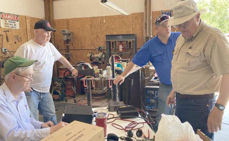 NATIONAL FIELD DAY—Members of the Top of Panhandle Amateur Radio Club participated in the AARL National Field Day on June 26. The idea behind the day was to practice communication skills in case of a disaster. Pictured are, from left, Jerome Doerrie, Larry Chancellor, Jim Lear and Dempsey Malaney.