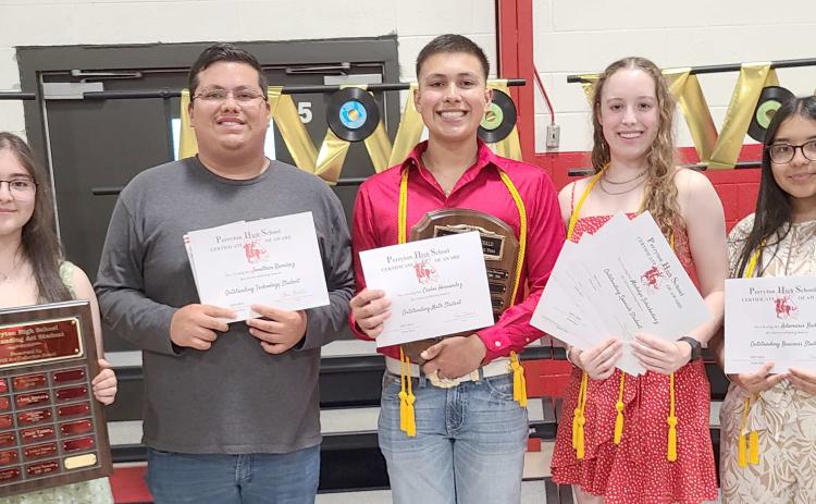Perryton High School students were honored and recognized for their academic achievements during the year at the Academic Awards Banquet held in the Rangerette Gym. Pictured are, from left, front row: Mayreli Navarrete (Outstanding Art Student), Jonathan Ramirez (Outstanding Technology Student), Carlos Hernandez (Outstanding Math and Journalism Student), Madelyn Schickedanz (Outstanding English, Science, Social Studies, and Spanish Student), and Adamaris Banos (Outstanding Business Student).