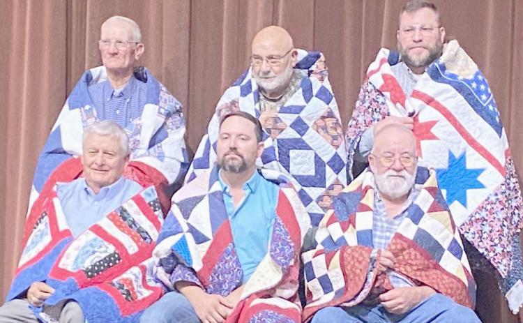 QUILTS OF VALOR HONOREES— The second group of veterans presented Quilts of Valor by the Friendship Quilt Guild on Oct. 16 were, first row, from left, Willis Smith, Byron Hoover and Robert Freeman; and second row, Bob Karber, Earl Hill and Jeff Mincy.