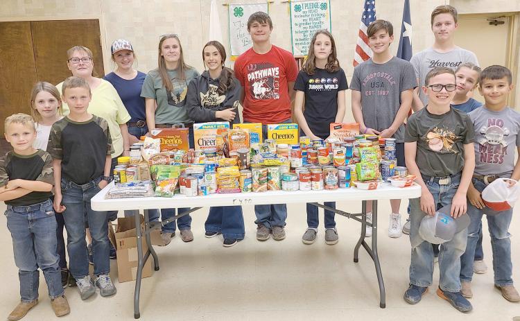 4-H FOOD DRIVE NETS OVER 200 ITEMS— Members of Ochiltree County 4-H held a scavenger hunt food drive last Thursday evening as teams of students roamed Perryton collecting food to donate to Jireh Food Ministry. Members collected 203 food items to donate to Jireh.