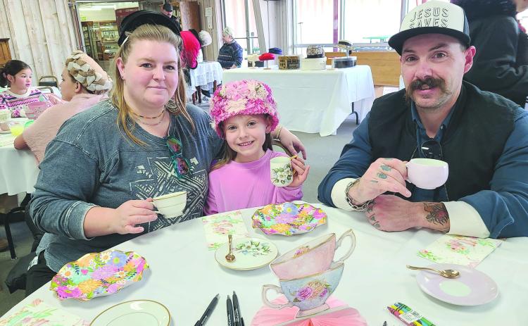 Parents, kids, and grandparents of all ages stopped by the Museum of the Plains on Sunday, Jan. 19, to enjoy an old-fashioned afternoon tea party. Party-goers picked out fancy hats to wear and enjoyed tea, punch, finger sandwiches, cookies, and plenty of good company, as well as checking out the museum’s new display of Doris Wilkens’ children’s tea set collection. Pictured are, from left, Carolyn Thomas, Juliza Thomas, age 6, and Jordan Thomas.