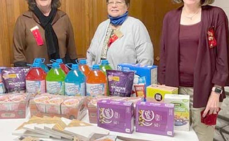 CRISIS CENTER GIFTS—The Eta Alpha chapter of Delta Kappa Gamma purchased snacks and arts and crafts items for the Panhandle Crisis Center as its project. Pictured are, from left, Lana Yeary, Sharon Cummings and Renee Lee.