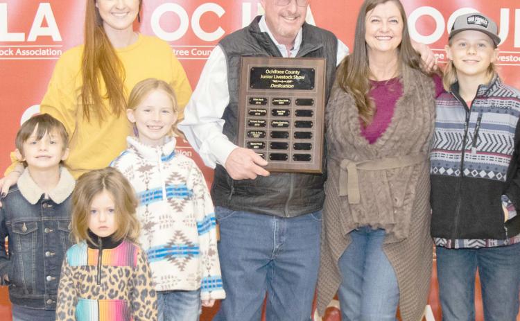 STOCK SHOW DEDICATED TO GASTINEAU— This year’s Ochiltree County Junior Livestock Show and Sale was dedicated to Richie Gastineau. Pictured are, in front, Bridgette Cole; in middle row, from left, Archie Cole and Scarlett Cole; and back row, Britta Cole, Richie Gastineau, Tanya Gastineau, and Silas Cole. ( Photo credit: Tessa Powell)