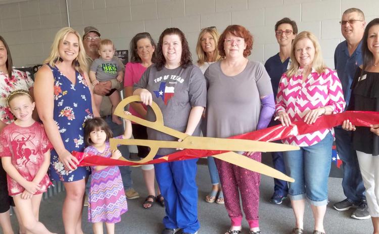 CHAMBER MEMBERS HOLD RIBBON CUTTING