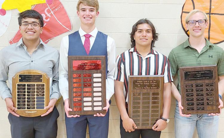 TOPS IN FOOTBALL—Perryton High School’s football team was honored on Monday evening at the Perryton High School All Sports Awards. Pictured are, from left: Junior Torres, who won the Best Football Lineman Award; Jacob Schollenbarger, winner of the Pete Peterson Award; Jahir Romero, Best Offensive Player; and Shep Miller, Best Defensive Player.
