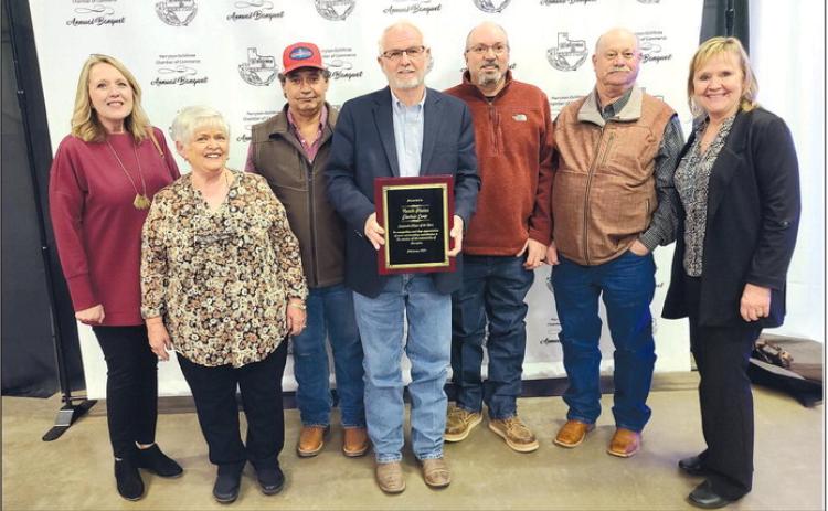 North Plains Electric Co-op was named the Corporate Citizen of the Year by the Perryton-Ochiltree Chamber of Commerce during its annual banquet on Feb. 22. Pictured from left are Wheatheart Council co-president Denise Wilmoth, executive secretary Paula Lehew, utility tech Martin Garza, executive vice president/general manager Randy Mahannah, engineering services manager Joe Lane, operations manager Ronald Harvey, and Wheatheart Council co-president Pam Chisum.