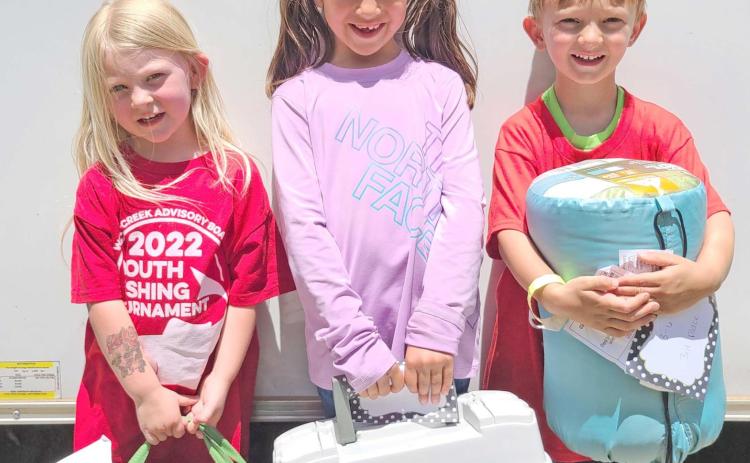 SMALL FRY, BIG FISH—Kids turned out in droves for Saturday’s Children’s Fishing Tournament at Lake Fryer and Wolf Creek Park. The top prize winners in the ages 3-6 category were, from left, Alice DeWitt (first place), Zoey Yara (second), and Camden Robinson (third).