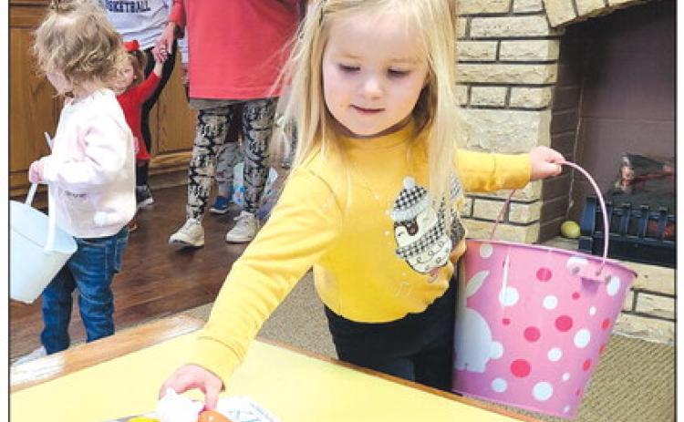 Perry Memorial Library’s last Story Time session of the year on Wednesday morning gave youngsters attending the program the chance to hunt for Easter eggs hidden around the library, in addition to listening to some stories and working on some arts and crafts projects. Yates Correll, age 3, came across a treasure trove of eggs in the library’s lobby.