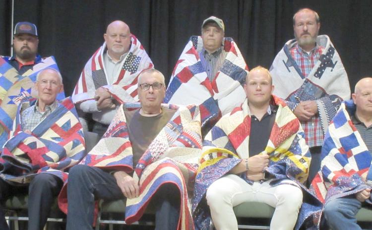 QUILTS OF VALOR PRESENTATIONS— The Friendship Quilt Guild presented 16 Quilts of Honor on Oct. 20. The quilts were given in two groups. The first group included, first row, from left, Charles Kelly, Dave Patterson, Tyler Harper and Mike Richardson; and second row, J.W. Brown, Matthew Harper, Stacy Brown and Ron Bishop. Not pictured is Stephen Montgomery “Monty” Joiner.