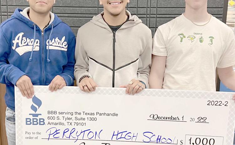 PHS STUDENTS WIN VIDEO CONTEST— Students in Perryton High School’s A/V Club submitted a video to the Better Business Bureau video contest in Amarillo, placing second and receiving a $1,000 check for new equipment for the club. The winning students were, from left, Sergio Campos, Edwin Ochoa, and Alex Jarrell. Not pictured is Samuel Perez.