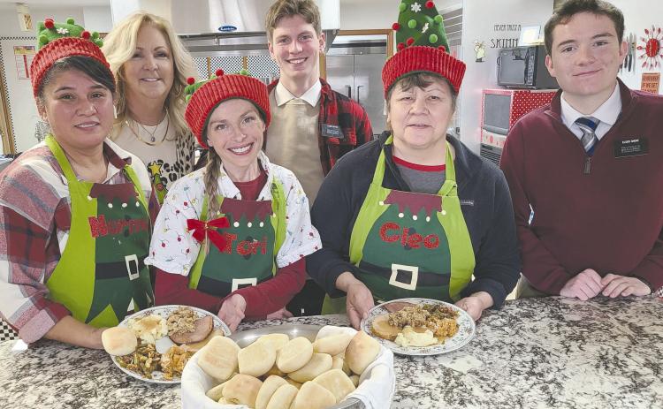 Santa’s elves at the Ochiltree County Senior Citizens Center cooked up the center’s annual Christmas lunch last week. The chefs at the center prepared a meal of turkey, dressing, ham, mashed potatoes and gravy, rolls, green bean casserole, and much more. Pictured are, from left, Norma Gonzales, Daryla Allred, Tori Blake, Elder Aiden Hatch, Cleo Flores, and Elder Jacob Stoke.