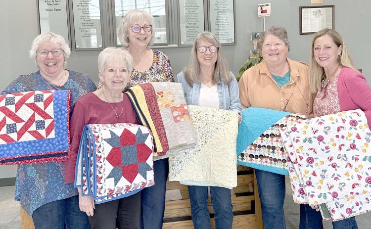 The Texas Panhandle Quilters Guild delivered homemade quilts to Perryton families affected by the tornado that struck the city on June 15. The original goal for the project was to make and deliver 25 quilts, but that number grew to 48 as more members of the guild wanted to participate. Pictured are some of the Amarillo area members who delivered quilts in early October, including, from left, Lucille Dudley, Pat Drake, Kathy Jones, Susan Kraft, Nancy Owen, and guild president Sherrie Elliott.