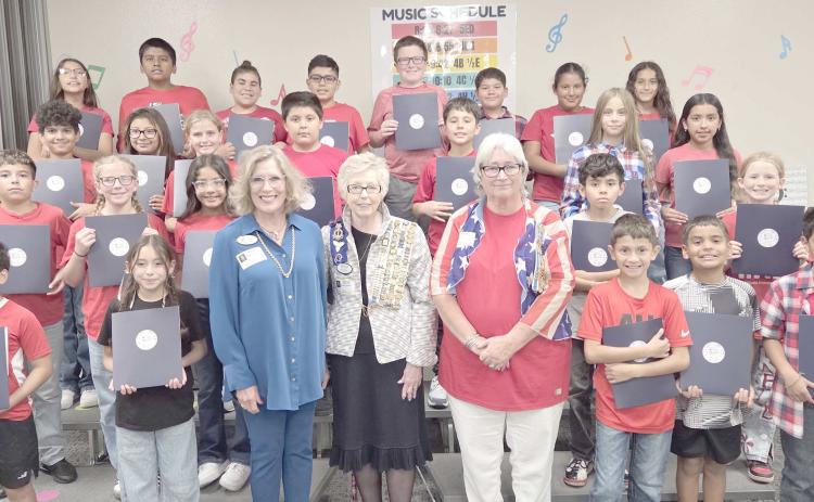DAR CELEBRATES CONSTITUTION DAY AT WILLIAMS— Members of the local Wolf Creek chapter of the National Society Daughters of the American Revolution visited Williams Intermediate Elementary School last Thursday to commemorate Constitution Week by delivering copies of the United States Constitution for every fifth grade classroom. Pictured with a small horde of Williams fifth graders are, in front, Melodee Rogers, Barbara Johnson, and Debra Dye.
