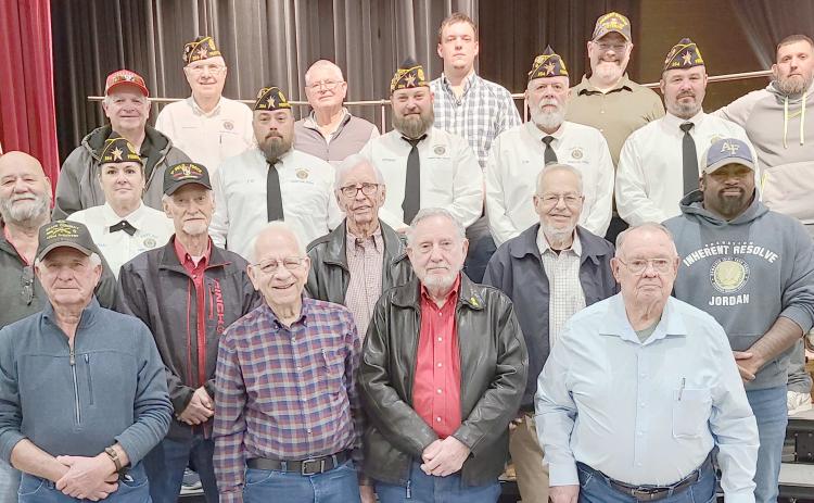 Area veterans were honored at Perryton High School’s annual Veterans Day program. Pictured are, from left, front row, are Doug McGarraugh, Senn Slemmons, Byerl Bates, and Robert Mantooth; second row, Ken Schwalk, Nikki Green, Duane McGarraugh, Bob Hulsey, Arvel Wall, and David Rogers; and third row, Mike Richardson, J.W. Brown, Chase Allison, J.W. Hardy, and Mike Skinner.
