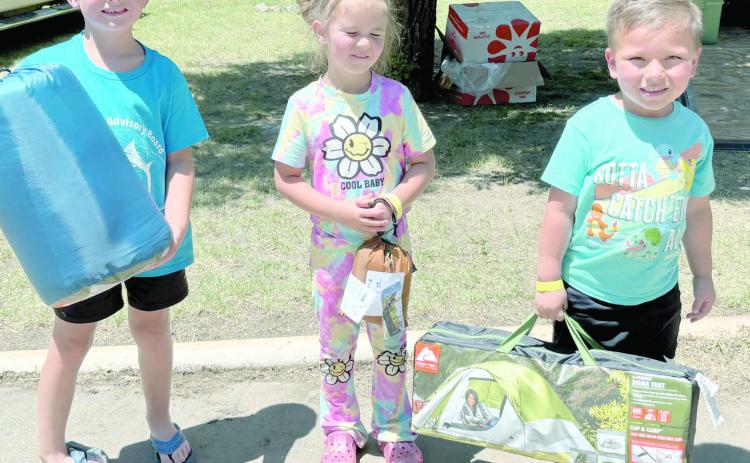 Kids turned out in droves for the Children’s Fishing Tournament at Lake Fryer and Wolf Creek Park at the beginning of June. The top prize winners in the ages 3-6 category were, from left, Granger Mills (third place), Emmalyn Lamb (second place), and Jesus Salazar (first place).