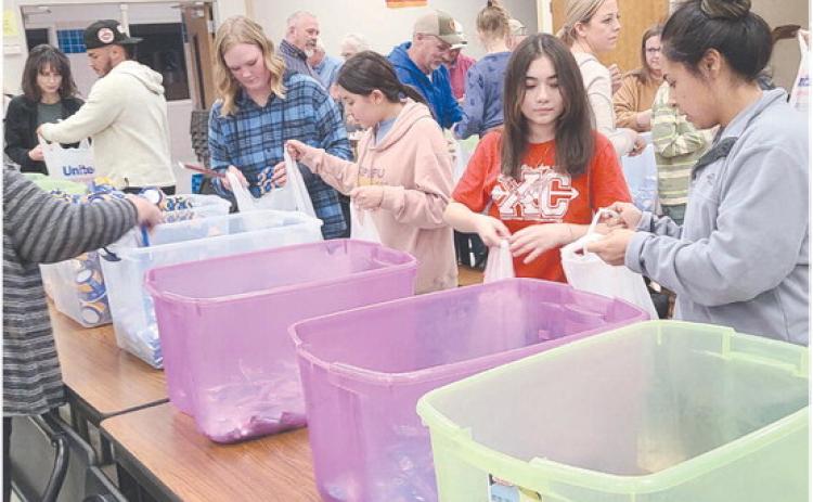 Local volunteers for Snack Pak 4 Kids gathered Monday evening at Williams Intermediate Elementary School to pack snacks for hungry kids. Volunteers meet every few weeks to pack snack bags with nutritious food to help food-insecure students stave off hunger. The Snack Pak 4 Kids program has been distributing over 100 packs every week to kids in Perryton.