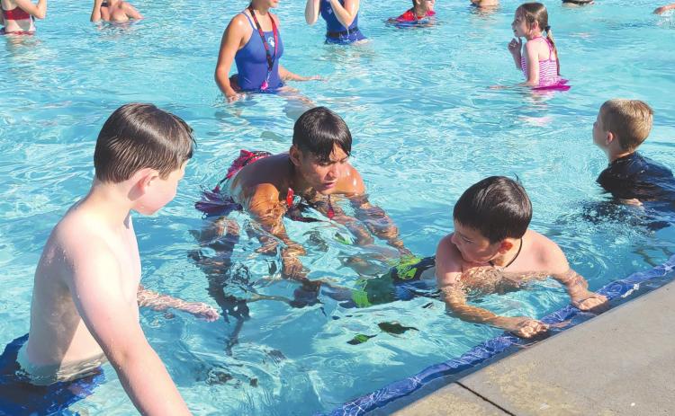 LEARNING TO SWIM