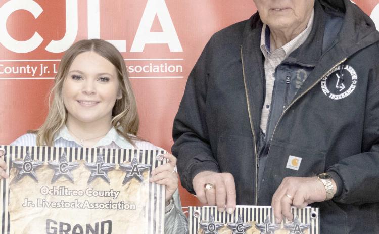 At the Ochiltree County Junior Livestock Show and Sale on Jan. 1617, Avery Swenhaugen took home the award for Grand Champion Swine. Her animal was purchased by Broken Arrow Crop Insurance. Pictured are, from left, Avery Swenhaugen and Larry Schickedanz. ( Photo Credit: Hailey Clark of Hailey Renee Photography)