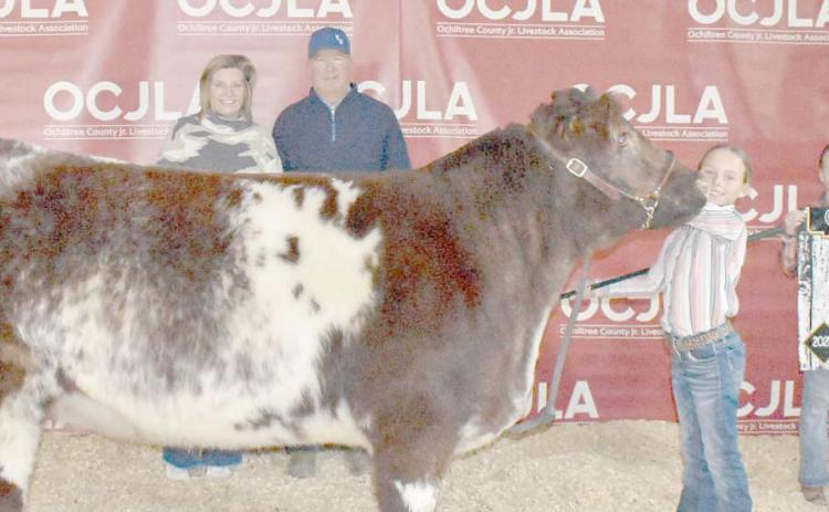At the Ochiltree County Junior Livestock Show and Sale on Jan. 17-18, Gabby Heck took home the award for Grand Champion Heifer. Her animal was purchased by Steven and Paige Waide. Pictured are, from left, Paige Waide, Steven Waide, Gabby Heck, and Izzy Heck. ( Photo credit: Morgan Dudley)