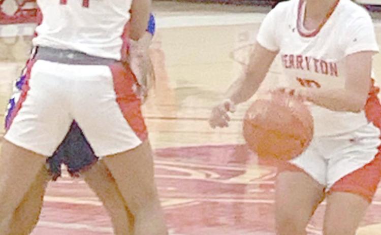 RETTE BASKETBALL—The Rangerettes hosted the Canyon Lady Eagles Tuesday in their second district game. The Lady Eagles dominated the contest, winning 73-33. Above, point guard Tonya Navarrete (10) dribbles by a pick set by Analia Loera (14) on her way to the bucket.