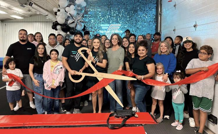 TOP RUSH ATHLETICS RIBBON CUTTING – Members of the Perryton-Ochiltree Chamber of Commerce, along with friends, family, staff, and well-wishers were on hand recently for a ribbon-cutting ceremony for Top Rush Athletics at 820 S. Industrial in Perryton. The gymnastics and cheerleading gym is owned by Anahi and Junior Amparan.
