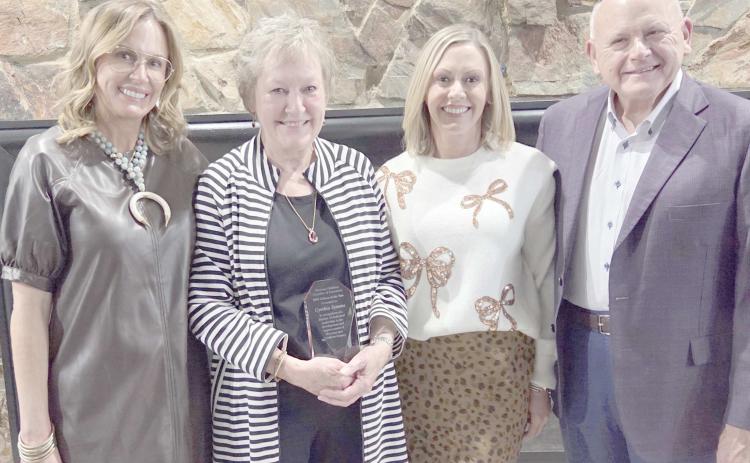 The family of Cynthia Symons turned out for the annual Perryton-Ochiltree Chamber of Commerce Banquet to congratulate her after being named the Citizen of the Year. Pictured are, from left, Melanie Symons Allen, Cynthia Symons, Kerry Symons, and Alyssa Symons Seay.