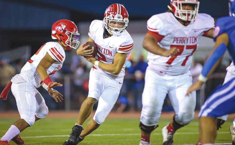 RANGERS FALL TO BOBCATS Perryton Ranger Stetson Garcia (middle) takes the handoff and looks for a seam during the 3rd quarter against the Childress Bobcats, who took the win with a score of 29-7. Next up, the Rangers will host Caprock for Homecoming. Game time is 7:00 P.M. See story for more information. (Photo courtesy of David Erickson)