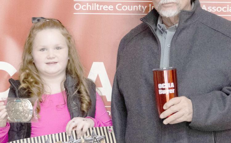 The award for Grand Champion Goat at the Ochiltree County Junior Livestock Show and Sale on Jan. 16-17 went to Bryar Herod. The animal was purchased by Lone Star Ag. Pictured from left are Bryar Herod and Keith Come. ( Photo credit: Hailey Clark of Hailey Renee Photography)