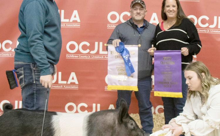 RESERVE GRAND CHAMPION SWINE— The award for Reserve Grand Champion Swine at the Ochiltree County Junior Livestock Show and Sale went to Landry Anderson. The animal was purchased by Hansford County Vet and Hansford County Vet Supply. Pictured from left are Landry Anderson, Tod and Kris Keeth, and Raylee Murry. ( Photo credit: Tessa Powell)