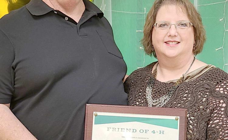 FRIENDS OF 4-H— During the annual awards ceremony for Ochiltree County 4-H at the Expo Center on Monday night, awards were presented for Friends of 4-H for individuals and businesses that go above and beyond to support 4-H programs with donations of time and material resources. Award winners included, from left, Sid and Stacey Tanner. Not pictured is Perryton Herald reporter Scott Slemmons.