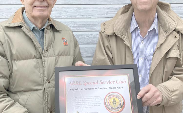TOPARC MEMBERS RECOGNIZE CLUB FOUNDERS— Members of the Top of the Panhandle Amateur Radio Club (TOPARC) met recently to celebrate the club’s 50th anniversary. Hugh Barton, at left, and Jerome Doerrie were recognized as the founders of the organization.