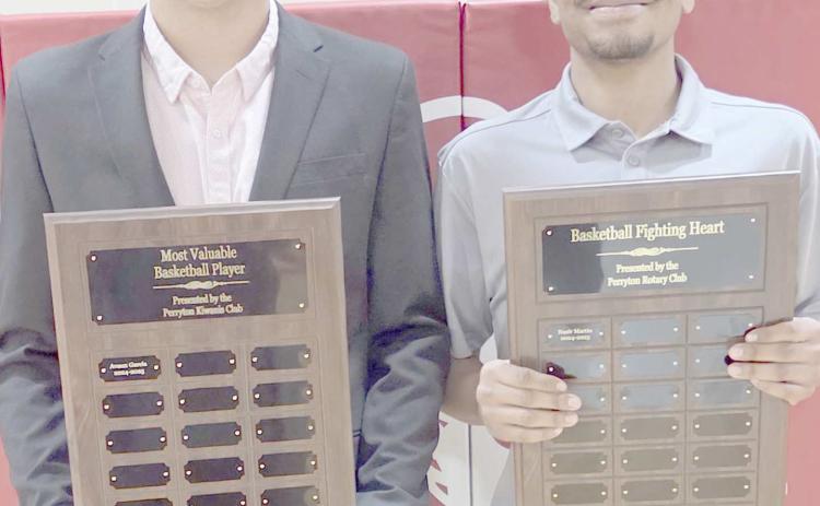BOYS HOOPSTERS BRING HOME AWARDS— Perryton High School’s boys basketball team was honored at the Perryton High School All Sports Awards Banquet. Pictured are, from left: Avaun Garcia, who brought home the boys MVP award, and Nasir Martin, winner of the Fighting Heart award.