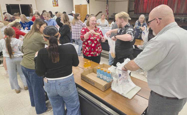Local volunteers for Snack Pak 4 Kids gathered Monday evening at Williams Intermediate Elementary School to pack snacks for hungry kids. Volunteers meet every few weeks to pack snack bags with nutritious food to help food-insecure students stave off hunger. Volunteers include students from Perryton High School, local business employees, church groups, and people who just want to help.