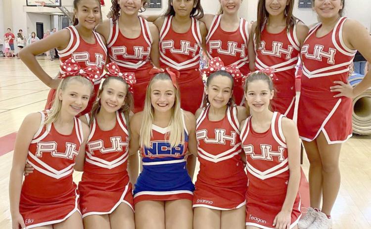PJH CHEERLEADERS—The Perryton Junior High Cheer Squad recently attended NCA camp at OU in Norman. Squad members are, first row, from left, Ella Brady, Juliet Mier, NCA Cheer Buddy Presley, Brianna Galvez and Teagan Duke; and second row, Geraldine Gamez, Kaleigh Potts, Mily Bernal, Tana Williams, Natalie Hernandez and Nevaeh Martinez.